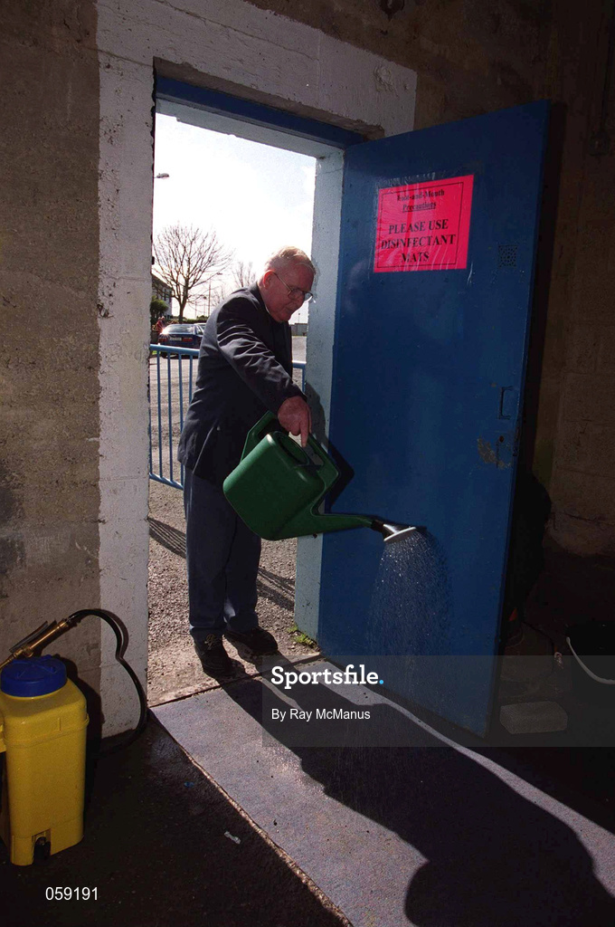 31 March 2001; "Kinger" Pat King, a member of the ground staff at Semple Stadium, sprays disinfectant on to a matt at an entrance in an effort to stop the spread of Foot and Mouth Disease before the AIB All-Ireland Senior Club Hurling Championship Semi-Final Replay match between Graigue Ballycallan and Sixmilebridge at Semple Stadium in Thurles, Tipperary. Photo by Ray McManus/Sportsfile