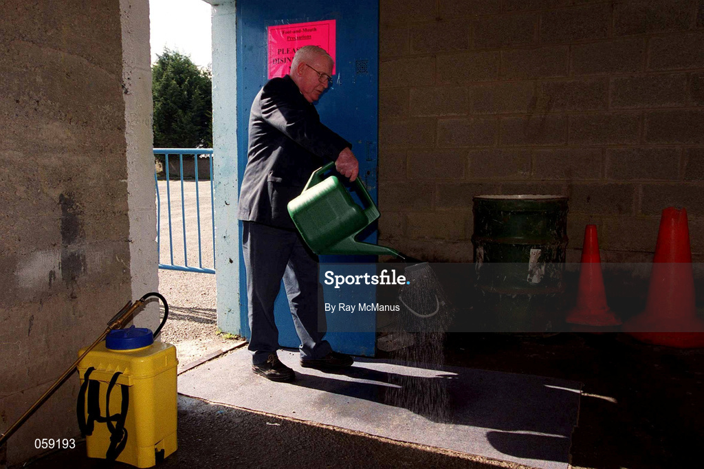 31 March 2001; "Kinger" Pat King, a member of the ground staff at Semple Stadium, sprays disinfectant on to a matt at an entrance in an effort to stop the spread of Foot and Mouth Disease before the AIB All-Ireland Senior Club Hurling Championship Semi-Final Replay match between Graigue Ballycallan and Sixmilebridge at Semple Stadium in Thurles, Tipperary. Photo by Ray McManus/Sportsfile