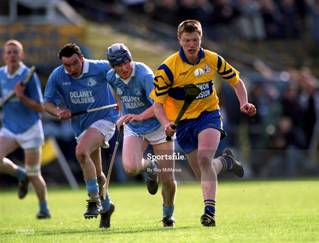 31 March 2001; Niall Gilligan of Sixmilebridge races away from Paddy O'Dwyer of Grague Ballycallan during the AIB All-Ireland Senior Club Hurling Championship Semi-Final Replay match between Graigue Ballycallan and Sixmilebridge at Semple Stadium in Thurles, Tipperary. Photo by Ray McManus/Sportsfile