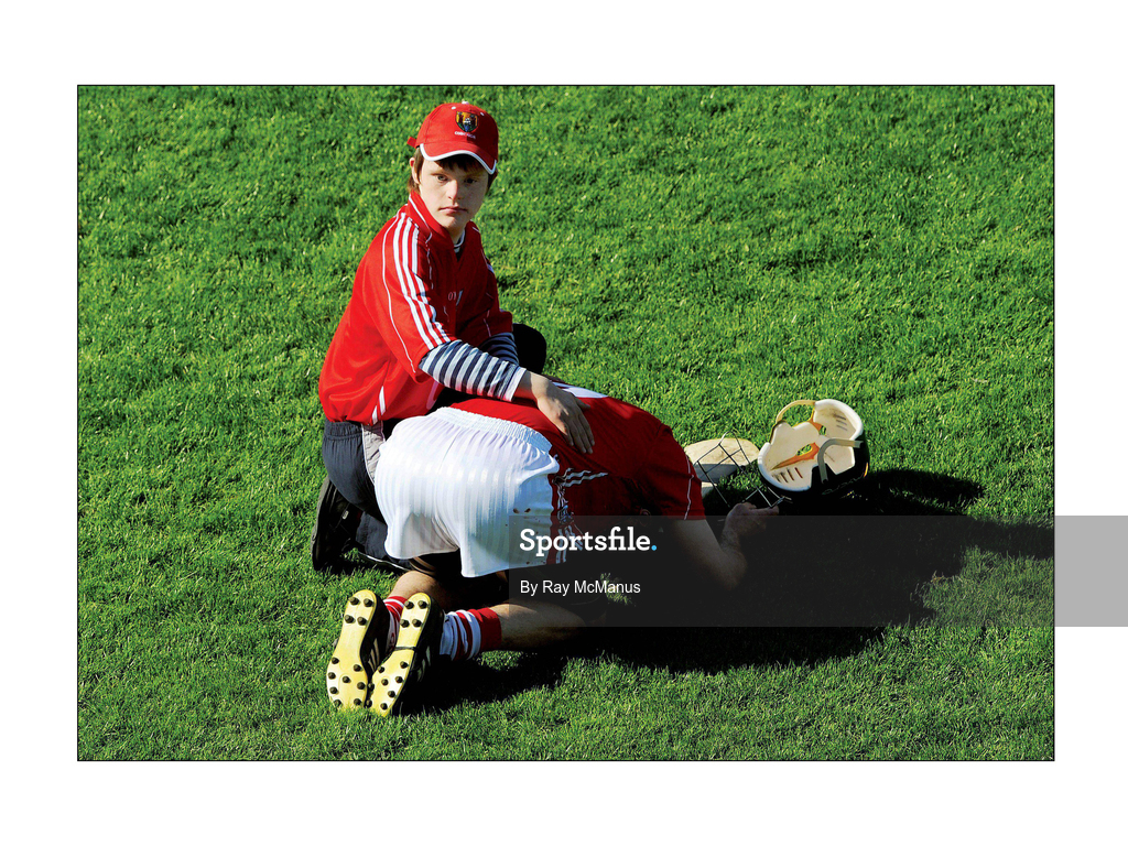31 May 2009; Cork's Jerry O'Connor is comforted by a supporter after the final whistle. Munster GAA Hurling Senior Championship Quarter-Final, Tipperary v Cork, Semple Stadium, Thurles, Co. Tipperary. Picture credit: Ray McManus / SPORTSFILE