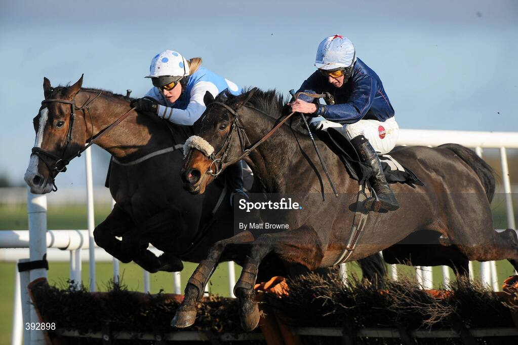 20 December 2009; Quarryfield Lass, with Conor Maxwell up, lead Culmullen Hall, with Jill Geraghty up, left, over the last on their way to winning the I.N.H. Stallion Owners European Breeders Fund Maiden Hurdle. Thurles Racecourse, Thurles, Co. Tipperary. Picture credit: Matt Browne / SPORTSFILE