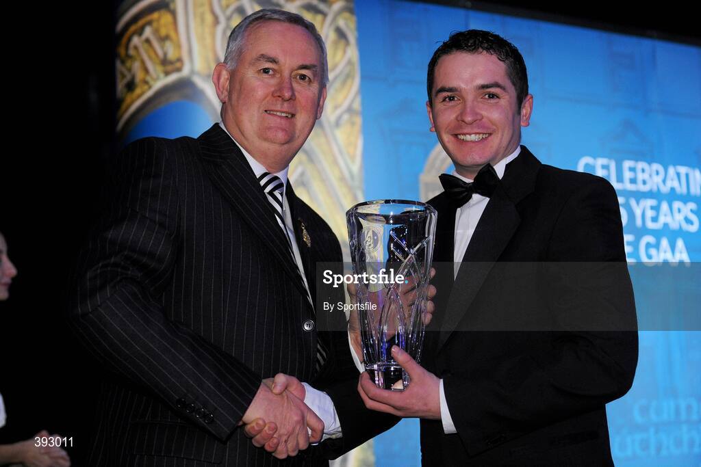 19 December 2009; PJ Kelly, St. Clare's Rounders Club, Cavan, is presented with his Rounders All-Star Award by Uachtarán CLG Criostóir Ó Cuana. Christy Ring/Nicky Rackard/Lory Meagher Champion 15 & Rounder All-Star Awards 2009, Croke Park, Dublin. Photo by Sportsfile