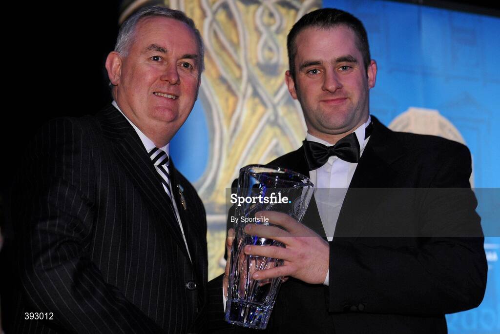 19 December 2009; Gerard Clerkin, Erne Eagles Rounders Club, Cavan, is presented with his Rounders All-Star Award by Uachtarán CLG Criostóir Ó Cuana. Christy Ring/Nicky Rackard/Lory Meagher Champion 15 & Rounder All-Star Awards 2009, Croke Park, Dublin. Photo by Sportsfile