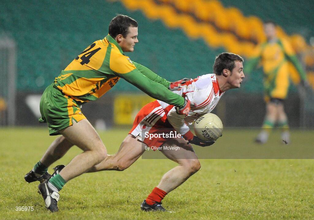 20 January 2010; Brian McGuigan, Tyrone, in action against Neil McGee, Donegal. Barrett Sports Lighting Dr. McKenna Cup, Group B, Donegal v Tyrone, MacCumhaill Park, Ballybofey, Co. Donegal. Picture credit: Oliver McVeigh / SPORTSFILE