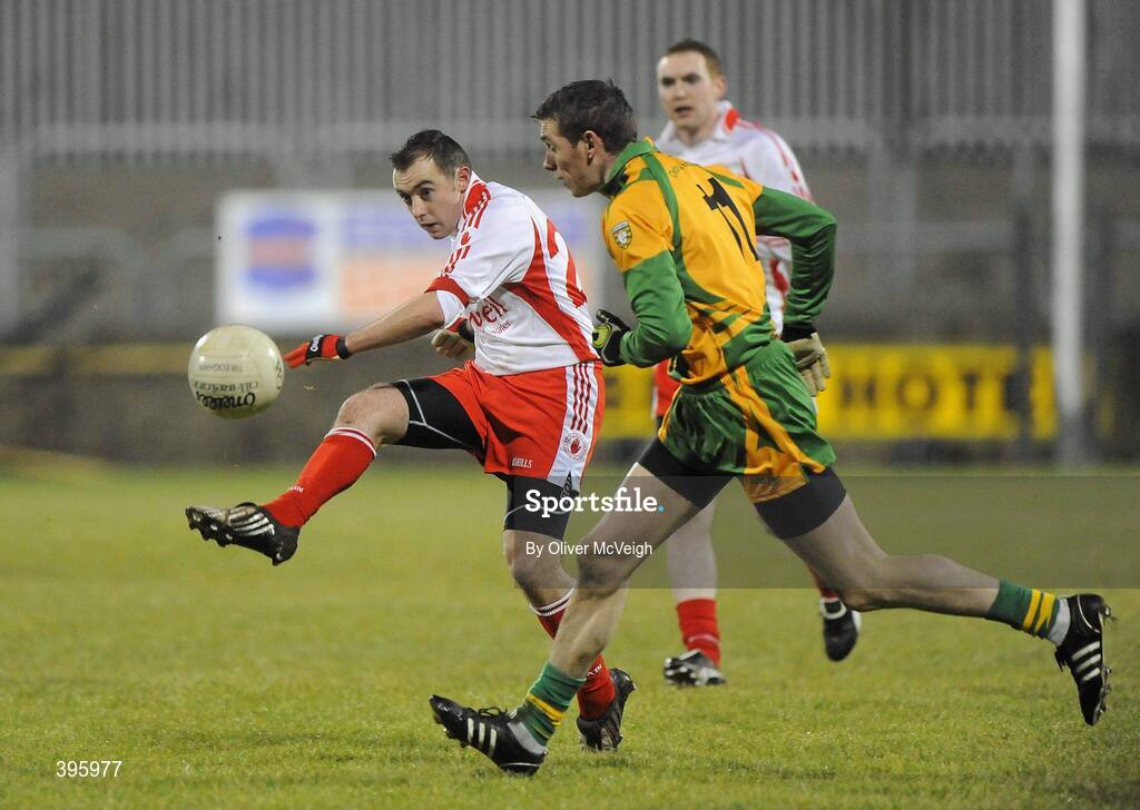 20 January 2010; Niall Gormley, Tyrone, in action against Edward Kelly, Donegal. Barrett Sports Lighting Dr. McKenna Cup, Group B, Donegal v Tyrone, MacCumhaill Park, Ballybofey, Co. Donegal. Picture credit: Oliver McVeigh / SPORTSFILE