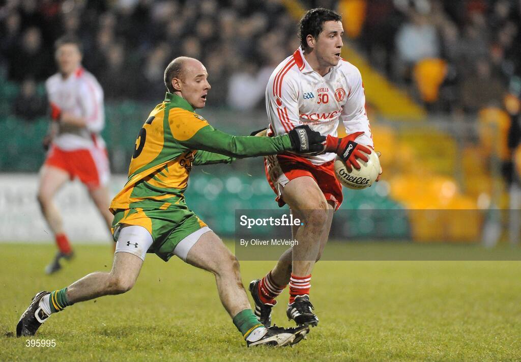 20 January 2010; Gareth Devlin, Tyrone, in action against James Keeney, Donegal. Barrett Sports Lighting Dr. McKenna Cup, Group B, Donegal v Tyrone, MacCumhaill Park, Ballybofey, Co. Donegal. Picture credit: Oliver McVeigh / SPORTSFILE