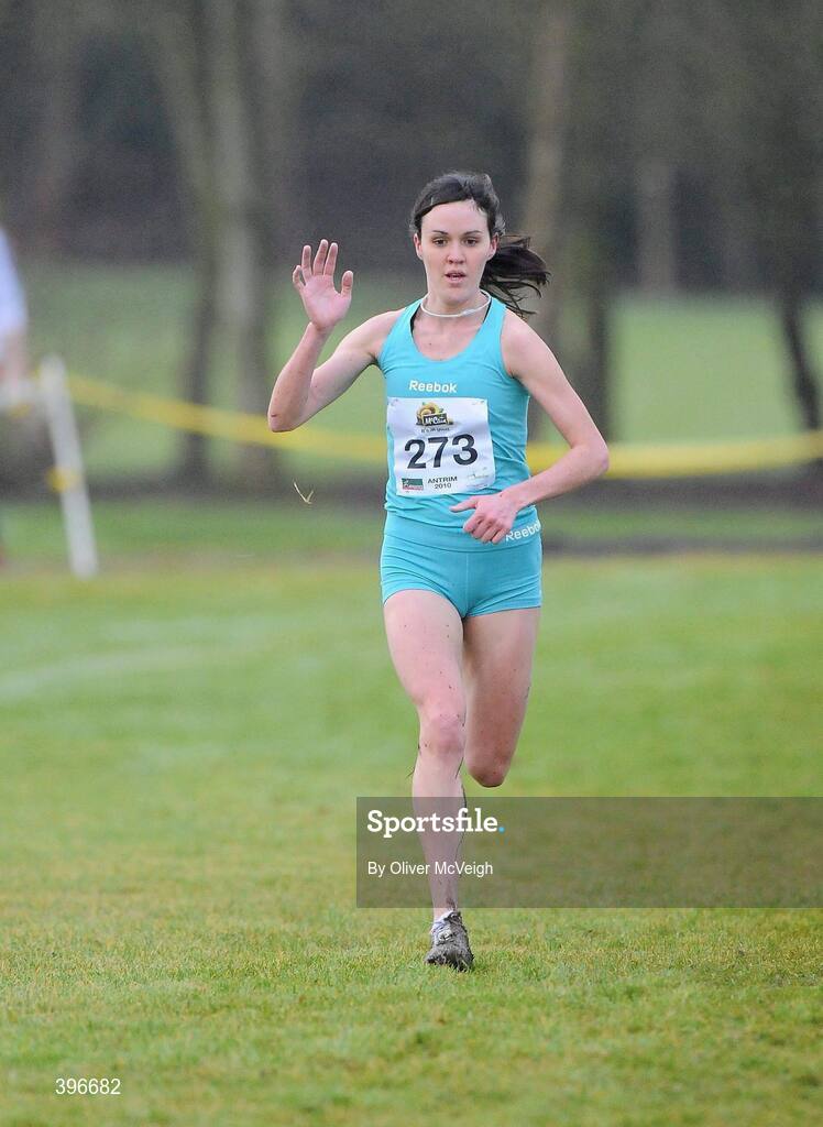 23 January 2010; Mary Cullen, Ireland, waves to the crowd as she runs up the home straight to win the Senior Women's race. Antrim IAAF International Cross Country, Greenmount Campus, Belfast, Co. Antrim. Picture credit: Oliver McVeigh / SPORTSFILE
