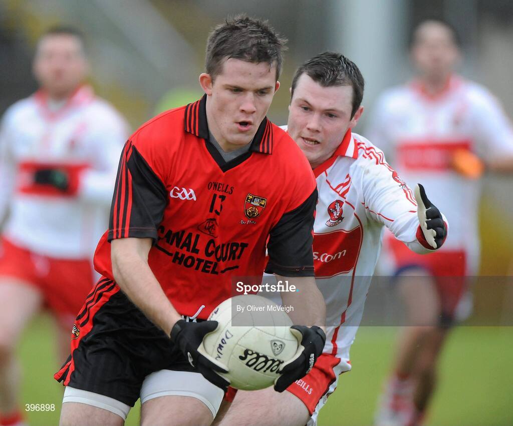 24 January 2010; Paul McComiskey, Down, in action against John O'Kane, Derry. Barrett Sports Lighting Dr. McKenna Cup, Group C, Derry v Down, Celtic Park, Derry. Picture credit: Oliver McVeigh / SPORTSFILE
