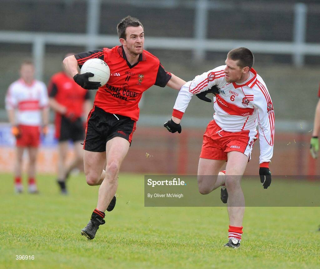 24 January 2010; Mark Poland, Down, in action against Barry McGuigan, Derry. Barrett Sports Lighting Dr. McKenna Cup, Group C, Derry v Down, Celtic Park, Derry. Picture credit: Oliver McVeigh / SPORTSFILE