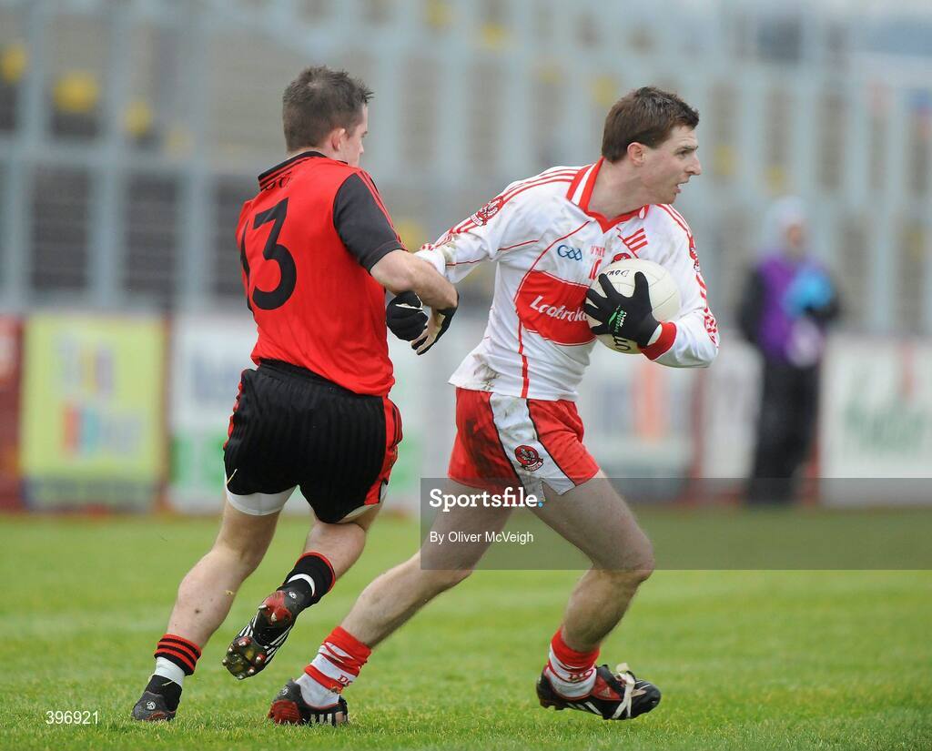 24 January 2010; Gerard O'Kane, Derry, in action against Paul McComiskey, Down. Barrett Sports Lighting Dr. McKenna Cup, Group C, Derry v Down, Celtic Park, Derry. Picture credit: Oliver McVeigh / SPORTSFILE