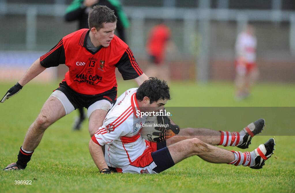 24 January 2010; Liam Hinphey, Derry, in action against Paul McComiskey, Down. Barrett Sports Lighting Dr. McKenna Cup, Group C, Derry v Down, Celtic Park, Derry. Picture credit: Oliver McVeigh / SPORTSFILE