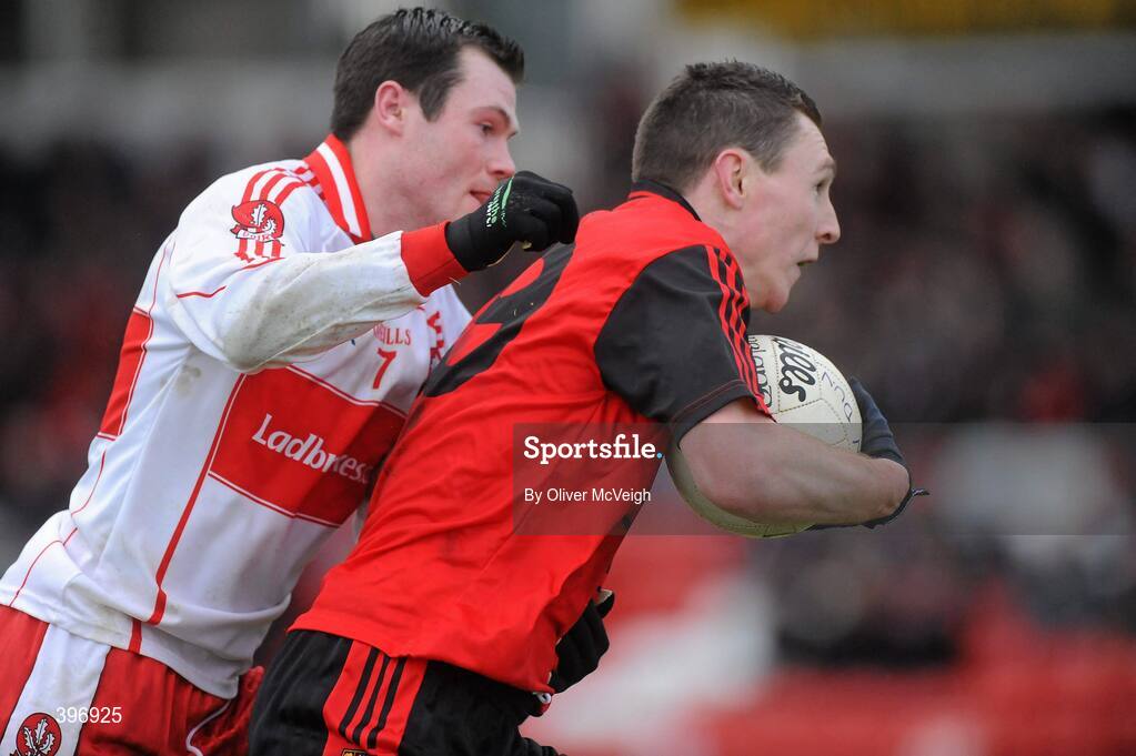 24 January 2010; John Clarke, Down, in action against John O'Kane, Derry. Barrett Sports Lighting Dr. McKenna Cup, Group C, Derry v Down, Celtic Park, Derry. Picture credit: Oliver McVeigh / SPORTSFILE