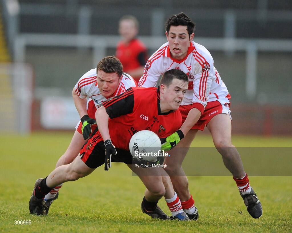24 January 2010; Conor Garvey, Down, in action against Paul Bradley and Aidy McLaughlin, Derry. Barrett Sports Lighting Dr. McKenna Cup, Group C, Derry v Down, Celtic Park, Derry. Picture credit: Oliver McVeigh / SPORTSFILE