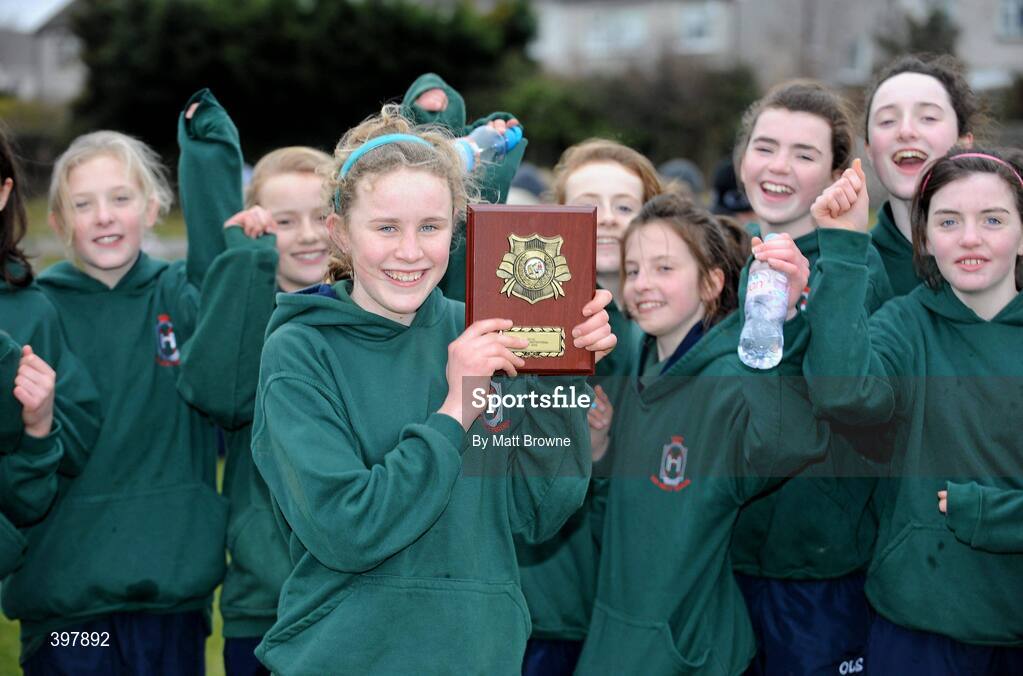27 January 2010; Winner of the Junior Girls 1500m Sarah Fitzpatrick, from Our Ladys School Templeogue, celebrates with her class-mates during the DCU Invitational Cross Country competition. Dublin City University, Glasnevin, Dublin. Picture credit: Matt Browne / SPORTSFILE