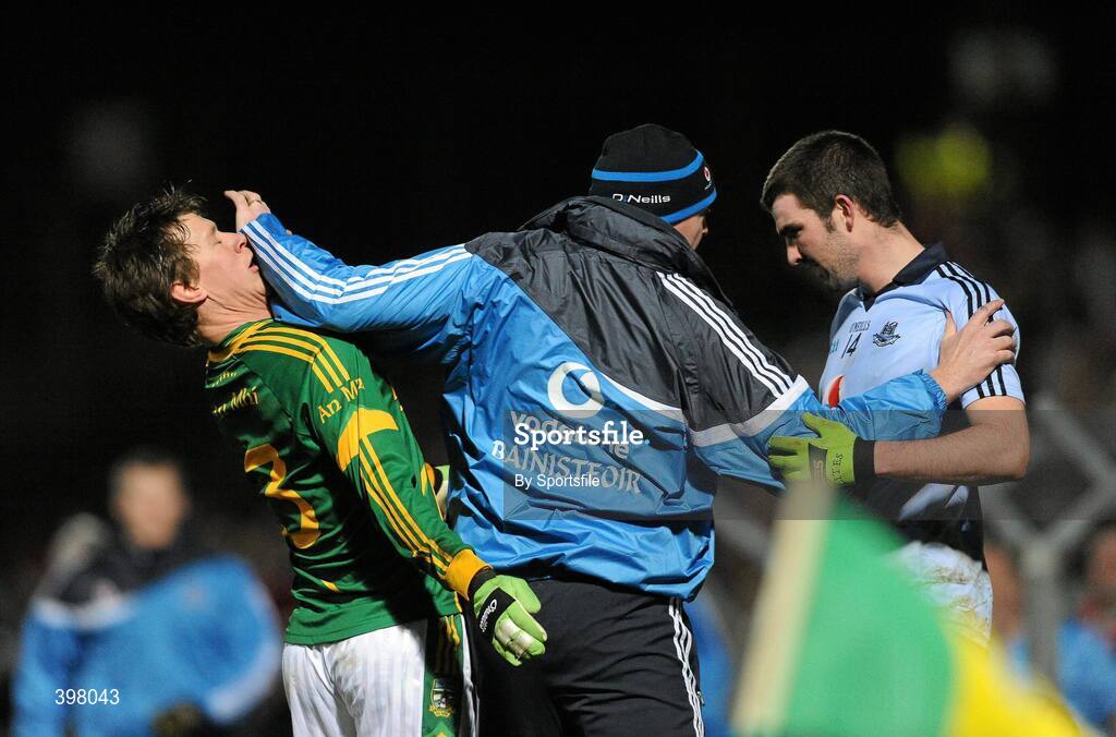 27 January 2010; Dublin manager Pat Gilroy, centre, tries to seperate his player Colin Daly, right, from Meath's James Macken during the game. O'Byrne Cup Quarter-Final replay, Meath v Dublin, Pairc Tailteann, Navan, Co. Meath. Photo by Sportsfile