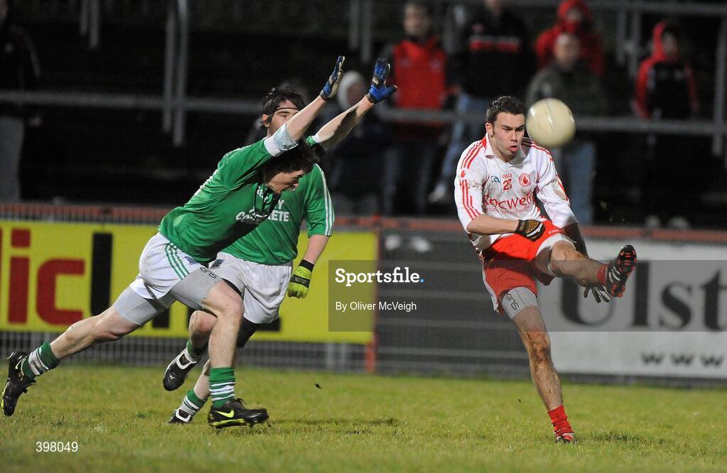 27 January 2010; Kyle Coney, Tyrone, shoots to score a point despite the attempts of  Peter Sherry, Fermanagh. Barrett Sports Lighting Dr. McKenna Cup Semi-Final, Tyrone v Fermanagh, Healy Park, Omagh, Co. Tyrone. Picture credit: Oliver McVeigh / SPORTSFILE