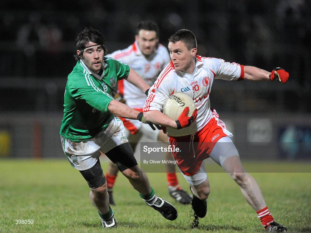 27 January 2010; Tommy McGuigan, Tyrone, in action against Barry Mulrone, Fermanagh. Barrett Sports Lighting Dr. McKenna Cup Semi-Final, Tyrone v Fermanagh, Healy Park, Omagh, Co. Tyrone. Picture credit: Oliver McVeigh / SPORTSFILE