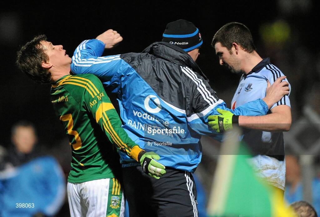 27 January 2010; Dublin manager Pat Gilroy, centre, tries to seperate his player Colin Daly, right, from Meath's James Macken during the game. O'Byrne Cup Quarter-Final replay, Meath v Dublin, Pairc Tailteann, Navan, Co. Meath. Photo by Sportsfile