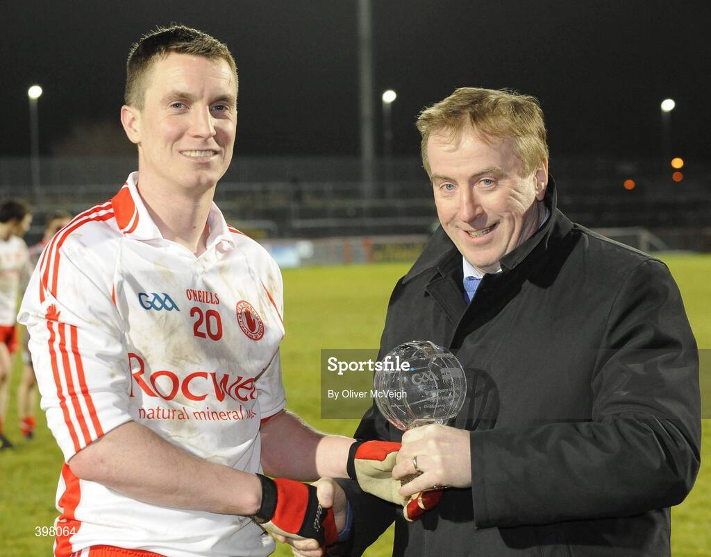 27 January 2010; Tyrone's Tommy McGuigan, receives the Barrett Sports Lighting Man of the Match, from Martin Barrett, Chief Executive, Barrett Sports Lighting. Barrett Sports Lighting Dr. McKenna Cup Semi-Final, Tyrone v Fermanagh, Healy Park, Omagh, Co. Tyrone. Picture credit: Oliver McVeigh / SPORTSFILE