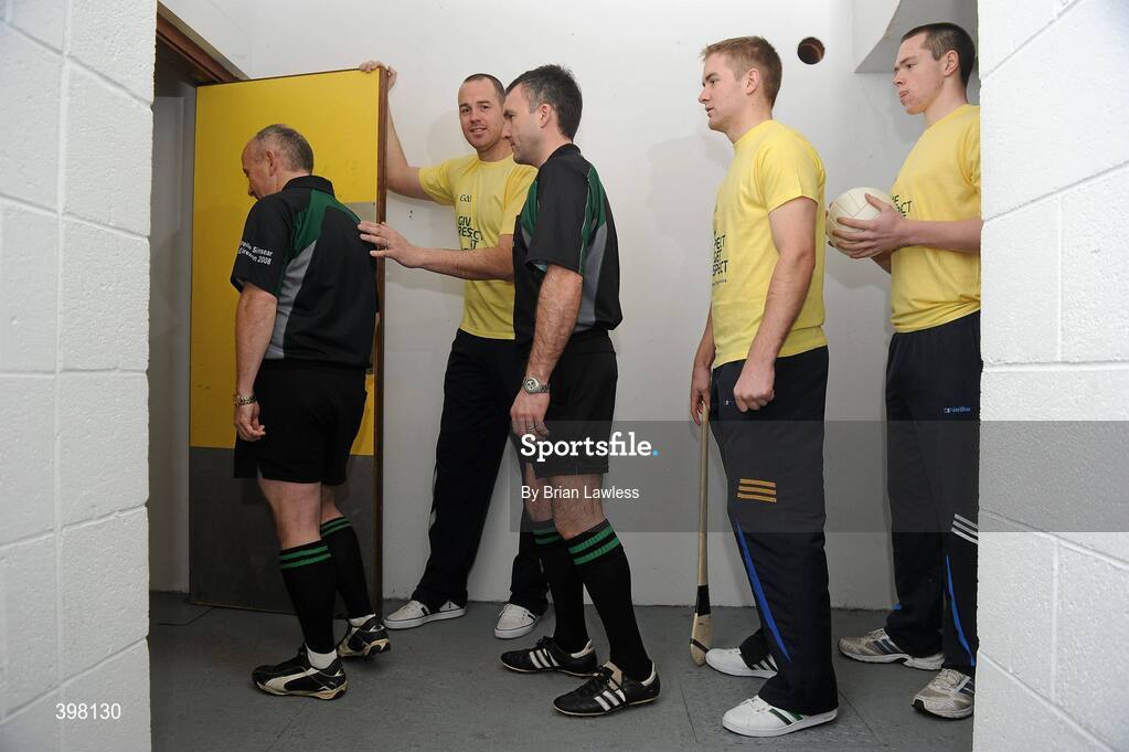 28 January 2010; The GAA has unveiled a new Respect Initiative aimed at fostering a new approach of fair play, mutual respect and good will to Gaelic football and hurling across all grades. A specific programme has been devised with clearly defined roles of responsibility for all of the key participants in our games including players, coaches, parents/guardians, managers and match officials. At the launch is Kerry footballer Micheal Quirke holding the door for, from left, football referee Marty Duffy, hurling referee Diarmuid Kirwan, Tipperary hurler Noel McGrath, and Dublin footballer Dean Rock. GAA Museum Auditorium, Croke Park, Dublin. Picture credit: Brian Lawless / SPORTSFILE  *** Local Caption ***