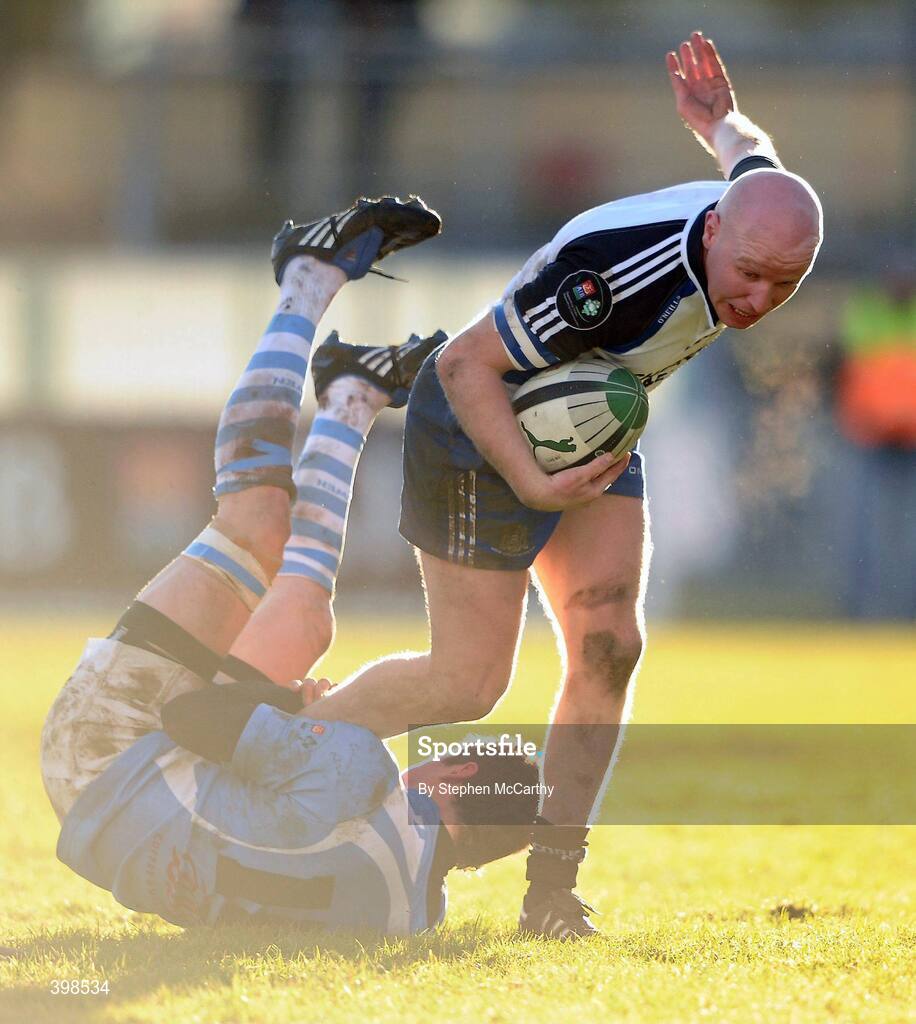 30 January 2010; Cronan Healy, Cork Constitution, is tackled by Ronan O'Mahony, Garryowen. AIB Cup Final, Cork Constitution v Garryowen, Dubarry Park, Athlone, Co. Westmeath. Picture credit: Stephen McCarthy / SPORTSFILE