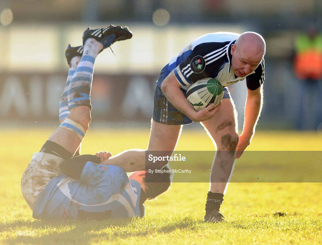 30 January 2010; Cronan Healy, Cork Constitution, is tackled by Ronan O'Mahony, Garryowen. AIB Cup Final, Cork Constitution v Garryowen, Dubarry Park, Athlone, Co. Westmeath. Picture credit: Stephen McCarthy / SPORTSFILE