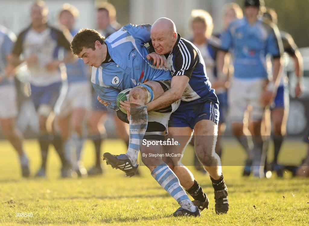 30 January 2010; Ronan O'Mahony, Garryowen, is tackled by Cronan Healy, Cork Constitution. AIB Cup Final, Cork Constitution v Garryowen, Dubarry Park, Athlone, Co. Westmeath. Picture credit: Stephen McCarthy / SPORTSFILE