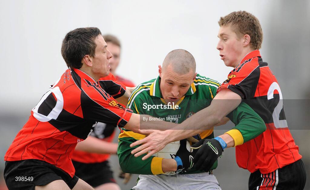 30 January 2010; Kieran Donaghy, Kerry, in action against Liam Jennings, left, and Peter Crowley, University College Cork. Munster GAA McGrath Cup Senior Football Final, Kerry v University College Cork, Austin Stack Park, Tralee, Co. Kerry. Picture credit: Brendan Moran / SPORTSFILE