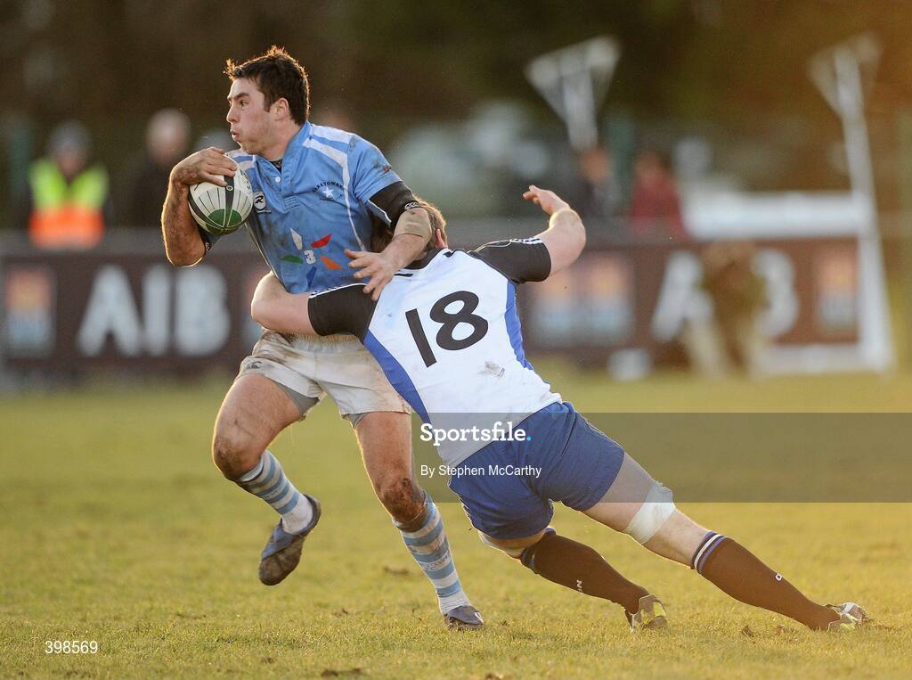 30 January 2010; Willie Staunton, Garryowen, is tackled by Brian Hayes, Cork Constitution. AIB Cup Final, Cork Constitution v Garryowen, Dubarry Park, Athlone, Co. Westmeath. Picture credit: Stephen McCarthy / SPORTSFILE