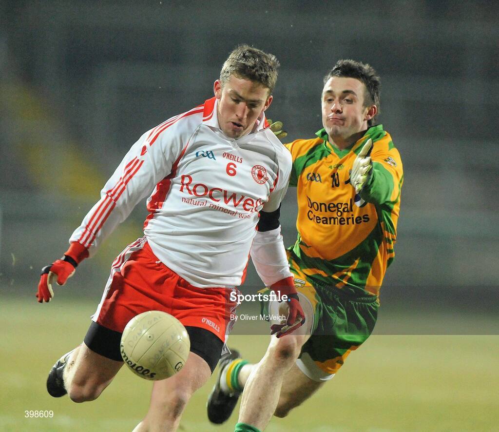 30 January 2010; Dermot Carlin, Tyrone, in action against David Walsh, Donegal. Barrett Sports Lighting Dr. McKenna Cup Final, Donegal v Tyrone, Brewster Park, Enniskillen, Co. Fermanagh. Picture credit: Oliver McVeigh / SPORTSFILE