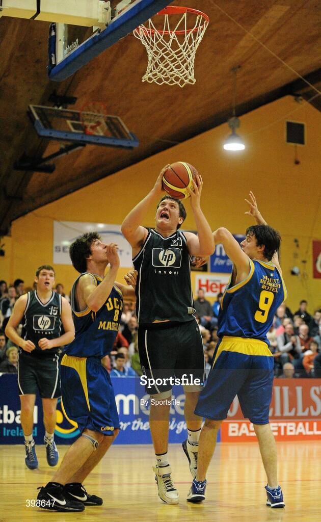 30 January 2010; Kenneth Hansberry, Maree, Galway, in action against Conor James, left, and Daniel James, right, UCD Marian, Dublin. Mens Under-20 National Cup Final, UCD Marian, Dublin v Maree, Galway, National Basketball Arena, Tallaght, Dublin. Photo by Sportsfile