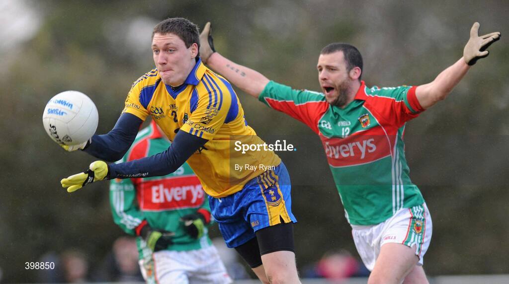 31 January 2010; Michael Killilea, Roscommon, in action against Trevor Mortimer, Mayo. Connacht FBD League, Section A, Round 3, Roscommon v Mayo, Ballinlough GAA Grounds, Ballinclough, Co. Roscommon. Picture credit: Ray Ryan / SPORTSFILE