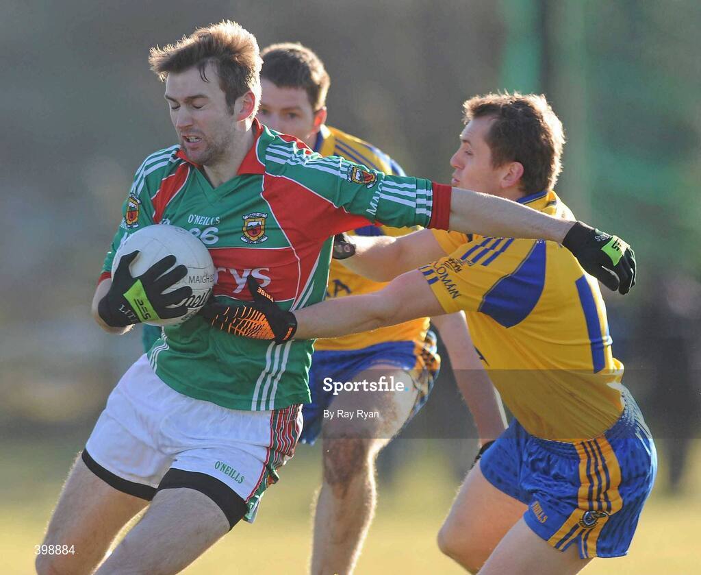 31 January 2010; Ronan McGarrity, Mayo, in action against Gary Cox, Roscommon. Connacht FBD League, Section A, Round 3, Roscommon v Mayo, Ballinlough GAA Grounds, Ballinclough, Co. Roscommon. Picture credit: Ray Ryan / SPORTSFILE