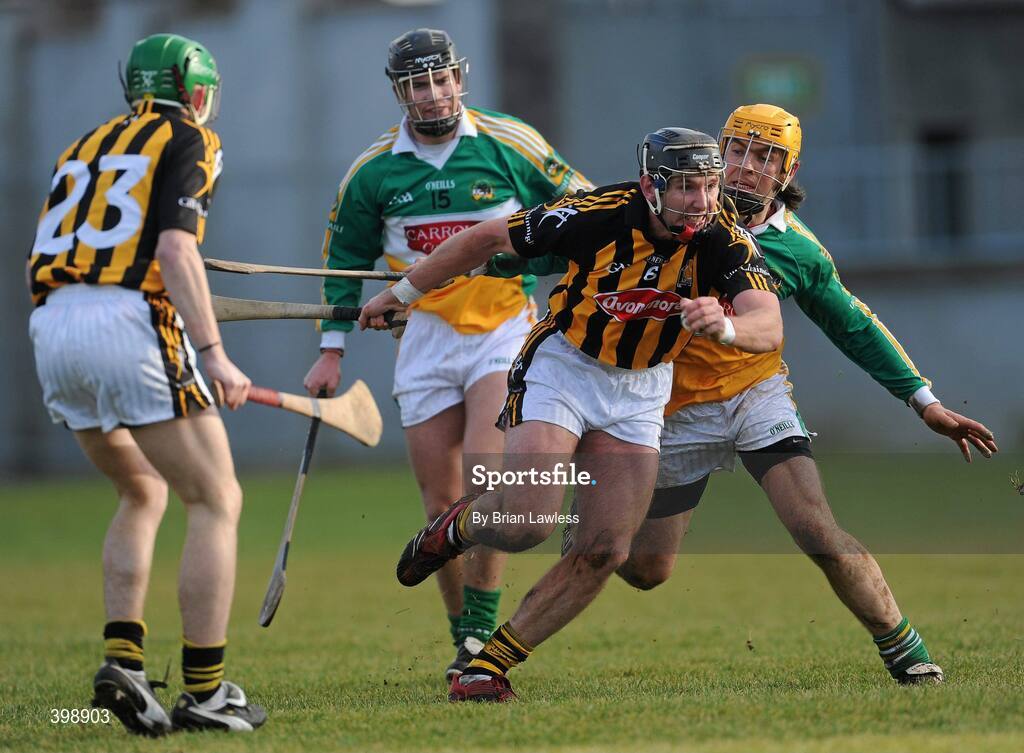 31 January 2010; P.J. Delaney, Kilkenny, in action against Ger Oakley and Daniel Currams, left, Offaly. Walsh Cup Quarter-Final, Offaly v Kilkenny, O'Connor Park, Tullamore, Co. Offaly. Picture credit: Brian Lawless / SPORTSFILE