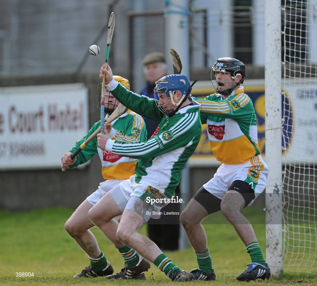 31 January 2010; Offaly goalkeeper James Dempsey, supported by James Rigney, left, and Stephen Egan, makes a save from a Kilkenny free during the Walsh Cup Quarter-Final match between Offaly and Kilkenny at O'Connor Park, Tullamore, Offaly. Photo by Brian Lawless/Sportsfile