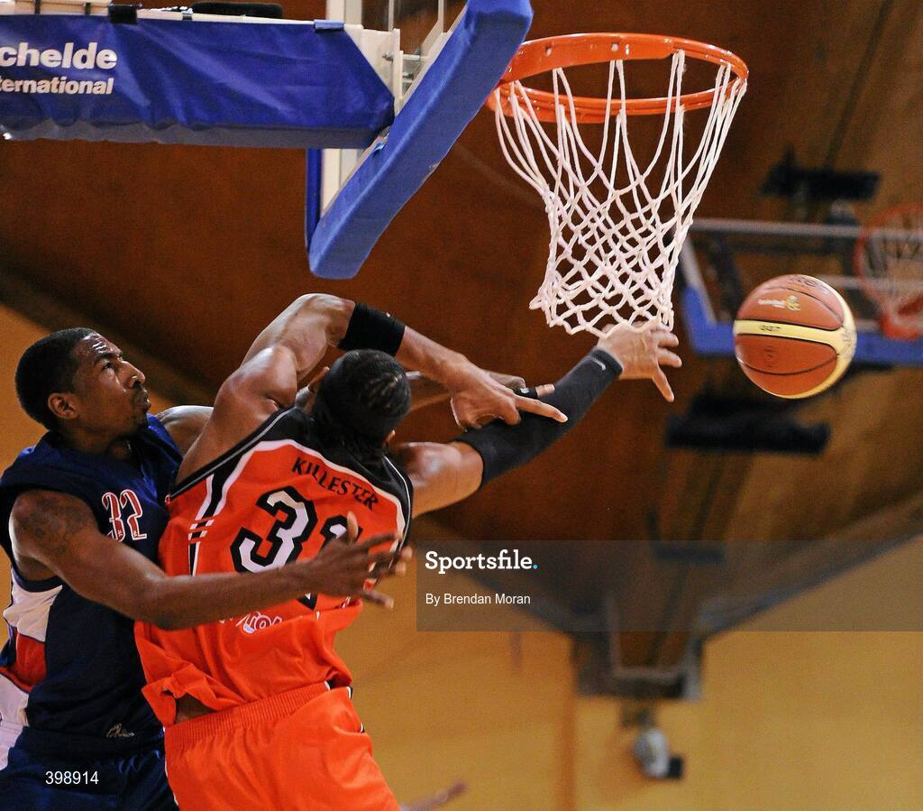 31 January 2010; Jermaine Turner, 31, Killester, blocks a shot by Joshua Johnson, UCC Demons. Men's Superleague National Cup Final 2010, Killester v UCC Demons, National Basketball Arena, Tallaght, Dublin. Picture credit: Brendan Moran / SPORTSFILE