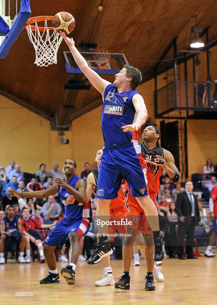 31 January 2010; Niall O'Reilly, UCC Demons, goes for a lay up against Jermaine Turner, Killester. Men's Superleague National Cup Final 2010, Killester v UCC Demons, National Basketball Arena, Tallaght, Dublin. Picture credit: Brendan Moran / SPORTSFILE