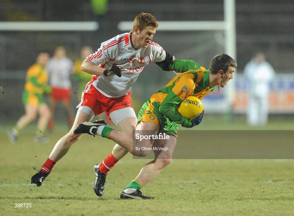 30 January 2010; Leo McLoone, Donegal, in action Niall McKenna, Tyrone. Barrett Sports Lighting Dr. McKenna Cup Final, Donegal v Tyrone, Brewster Park, Enniskillen, Co. Fermanagh. Picture credit: Oliver McVeigh / SPORTSFILE