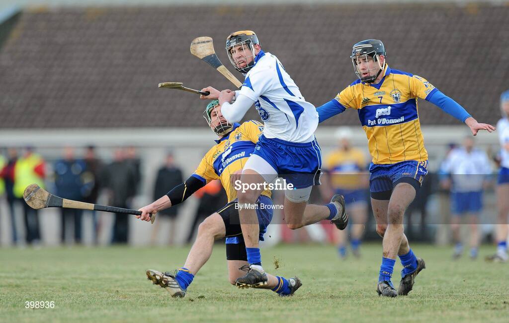 31 January 2010; Maurice Shanahan, Waterford, in action against Cormic O'Donovan and Pat Donnellan, 7, Clare. Munster GAA Waterford Crystal Hurling Cup Semi-Final, Waterford v Clare, Ballyduff GAA Grounds, Ballyduff Upper, Waterford. Picture credit: Matt Browne / SPORTSFILE