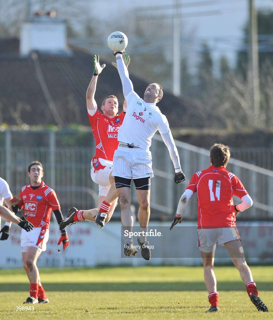 31 January 2010; Dermot Earley, Kildare, wins a high ball against Ronan Carroll, Louth. O'Byrne Cup Semi-Final, Kildare v Louth, St Conleth's Park, Newbridge, Co. Kildare. Picture credit: Barry Cregg / SPORTSFILE