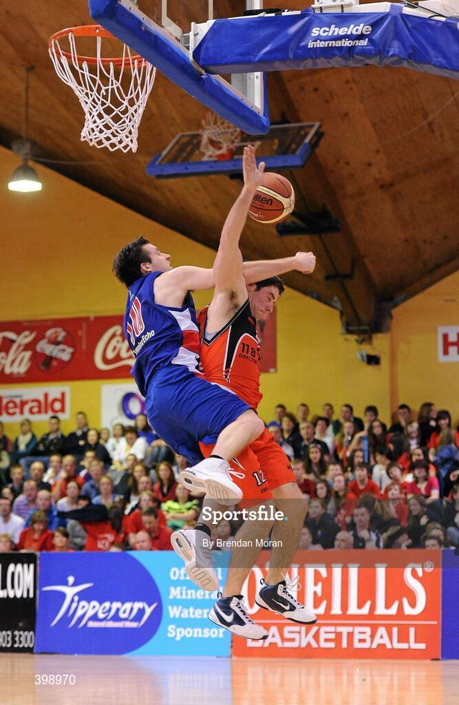 31 January 2010; Pete Madsen, Killester, is fouled by David Murphy, UCC Demons. Men's Superleague National Cup Final 2010, Killester v UCC Demons, National Basketball Arena, Tallaght, Dublin. Picture credit: Brendan Moran / SPORTSFILE