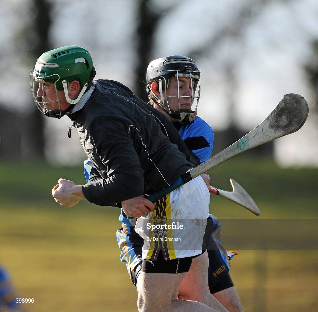 31 January 2010; Dermot Flynn, Wexford, in action against Joe Maher, UCD. Walsh Cup Quarter-Final, Wexford v UCD, Pairc Ui Siochan, Gorey, Co. Wexford. Picture credit: Daire Brennan / SPORTSFILE