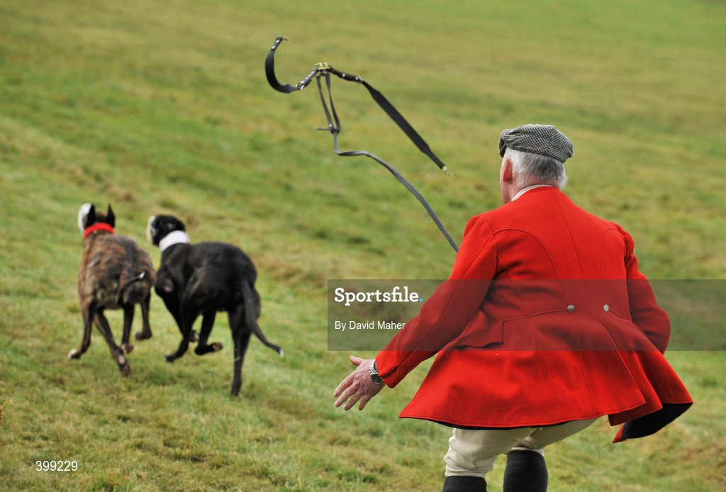 1 February 2010; Slipper Richie Quinn, slips Central Mentor, red collar, and Claddagh Hight, during the first round of the Boylesports.com Derby. 85th National Coursing Meeting - Monday, Powerstown Park, Clonmel, Co. Tipperary. Picture credit: David Maher / SPORTSFILE