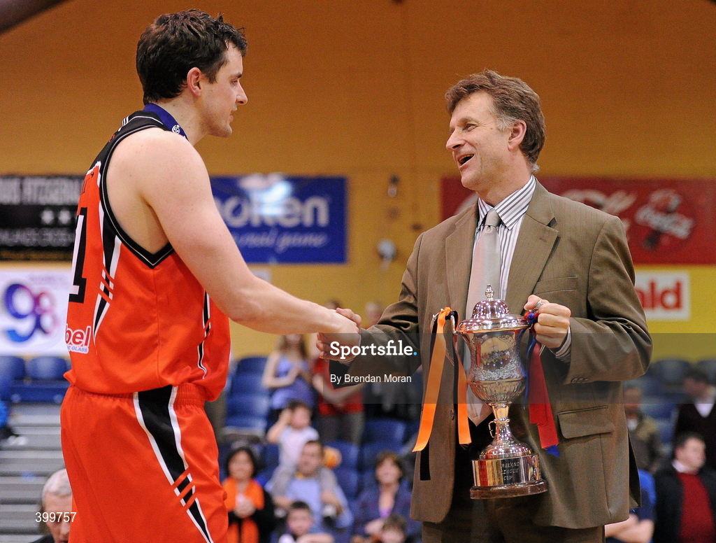 31 January 2010; Killester captain Paddy Kelly is presneted with the cup by Pat Duffy, Superleague Chairman. Men's Superleague National Cup Final 2010, Killester v UCC Demons, National Basketball Arena, Tallaght, Dublin. Picture credit: Brendan Moran / SPORTSFILE