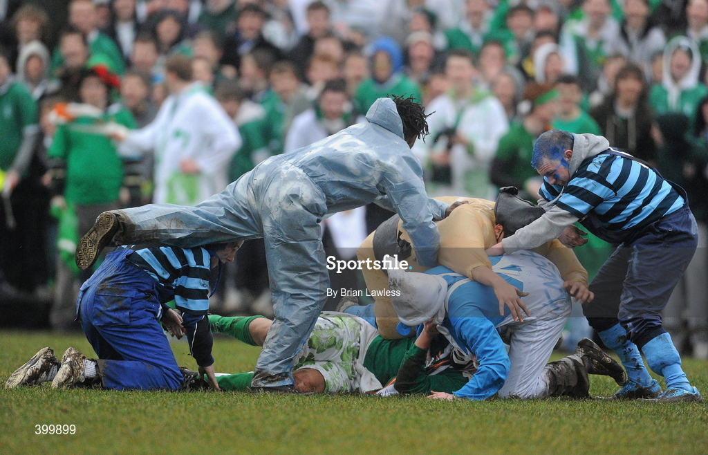 4 February 2010; Castleknock College supporters tackle a Gonzaga College SJ supporter to the ground after he tackled their fellow pupil. Leinster Schools Senior Cup 1st Round, Gonzaga College SJ v Castleknock College, Stradbrook Road, Blackrock, Co. Dublin. Picture credit: Brian Lawless / SPORTSFILE