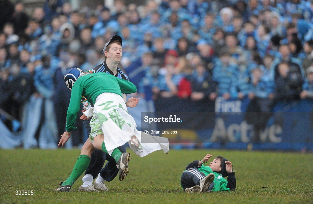 4 February 2010; A supporter is tackled to the ground by a Gonzaga College SJ supporter in retaliation for his tackling a young supporter to the ground. Leinster Schools Senior Cup 1st Round, Gonzaga College SJ v Castleknock College, Stradbrook Road, Blackrock, Co. Dublin. Picture credit: Brian Lawless / SPORTSFILE