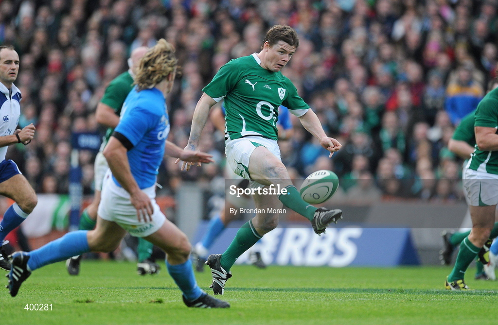 6 February 2010; Brian O’Driscoll, Ireland, kicks downfield as he is challenged by Mirco Bergamasco, Italy. RBS Six Nations Rugby Championship, Ireland v Italy, Croke Park, Dublin. Picture credit: Brendan Moran / SPORTSFILE