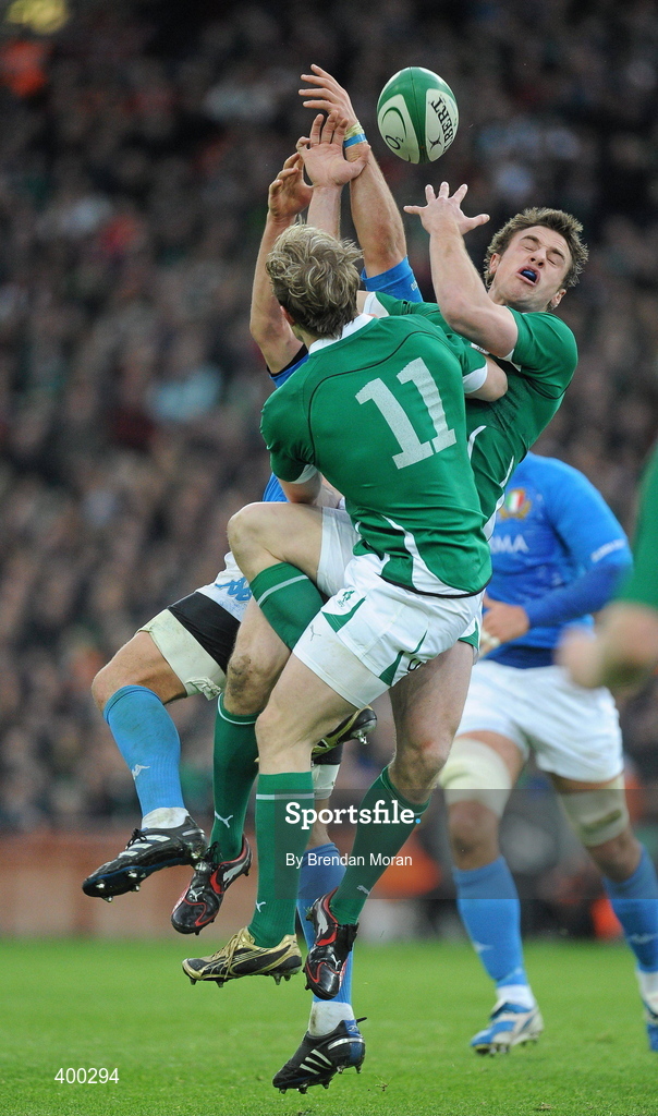 6 February 2010; Tommy Bowe and Andrew Trimble, Ireland, contest a high ball against Josh Sole, Italy. RBS Six Nations Rugby Championship, Ireland v Italy, Croke Park, Dublin. Picture credit: Brendan Moran / SPORTSFILE