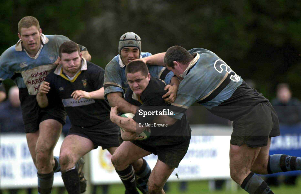 14 April 2001; Ajay Derwin of Ballymena is tackled by Junior Charlie and Peter Bracken, 3, of Galwegians during the AIB League Division One match between Ballymena and Galwegians at Ballymena Rugby Club in Antrim. Photo by Matt Browne/Sportsfile