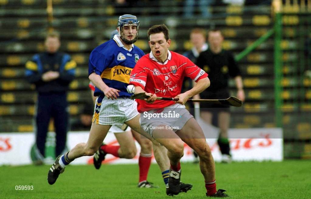 15 April 2001; Alan Browne of Cork gets past Paul Kelly of Tipperary during the Allianz GAA National Hurling League Division 1B Round 5 match between Tipperary and Cork at Semple Stadium in Thurles, Tipperary. Photo by Damien Eagers/Sportsfile